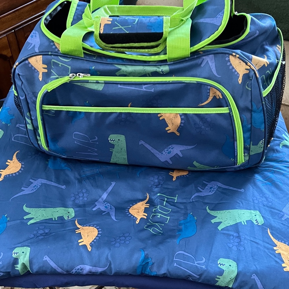Dinosaur Print Blue Duffle Bag with Green Accents and Sleeping Bag